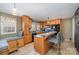 Well-lit kitchen featuring wooden cabinets, modern appliances, and an inviting island at 2407 Brookside Ave, Kannapolis, NC 28081