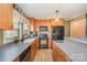 Modern kitchen with wooden cabinets, sleek appliances, and ample counter space at 2407 Brookside Ave, Kannapolis, NC 28081