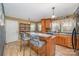 Charming kitchen with wooden cabinets, a functional island, and great natural light at 2407 Brookside Ave, Kannapolis, NC 28081