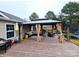 Relaxing backyard patio with gazebo and seating area at 249 Planters Row Rd, Iron Station, NC 28080