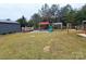 Large backyard with playset and gravel area at 249 Planters Row Rd, Iron Station, NC 28080