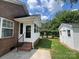 Sunroom and shed in backyard with brick home and landscaping at 2509 Calgary Pl, Concord, NC 28027