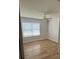 Well-lit bedroom featuring wood flooring and a ceiling fan at 2509 Calgary Pl, Concord, NC 28027