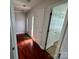 Hardwood floor hallway with doors to other rooms at 2509 Calgary Pl, Concord, NC 28027