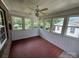 Sunroom with tile floor and multiple windows offering backyard views at 2509 Calgary Pl, Concord, NC 28027