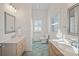 Clean bathroom with light teal tile floor and dual vanities at 2635 Queens Dr, Lincolnton, NC 28092