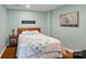 Basement bedroom with a wooden bed frame and serene, neutral decor at 2635 Queens Dr, Lincolnton, NC 28092