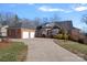 Two-story brick home with a three-car garage and driveway at 2635 Queens Dr, Lincolnton, NC 28092