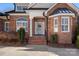 Brick front entrance with a gray door and sidelights at 2635 Queens Dr, Lincolnton, NC 28092