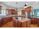 Island kitchen with granite countertops and wood cabinets at 2635 Queens Dr, Lincolnton, NC 28092