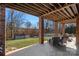 Brick patio with seating area overlooking backyard and pool at 2635 Queens Dr, Lincolnton, NC 28092