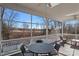 Screened porch with table and chairs, offering scenic views at 2635 Queens Dr, Lincolnton, NC 28092