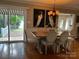 Bright dining room with lake view and modern table at 273 Leeward Point Loop, Taylorsville, NC 28681