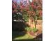 Landscaped garden with crape myrtles and brick wall at 273 Leeward Point Loop, Taylorsville, NC 28681