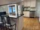 Kitchen with stainless steel appliances and wood floors at 273 Leeward Point Loop, Taylorsville, NC 28681