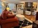 Living room with stone fireplace and large mirror at 273 Leeward Point Loop, Taylorsville, NC 28681