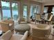 Bright sunroom with lake views and comfortable seating at 273 Leeward Point Loop, Taylorsville, NC 28681