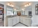 Double vanity bathroom with granite countertops and a large mirror at 273 Sweet Briar Dr, Fort Mill, SC 29707