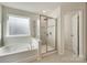 Luxurious bathroom with a soaking tub and a walk-in shower at 273 Sweet Briar Dr, Fort Mill, SC 29707