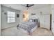 Bright bedroom with a queen bed, ceiling fan, and ample closet space at 273 Sweet Briar Dr, Fort Mill, SC 29707