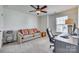 Bedroom with sofa, desk, and large window providing natural light at 273 Sweet Briar Dr, Fort Mill, SC 29707