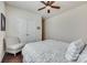 Cozy bedroom with a ceiling fan, double doors, and a patterned chair at 273 Sweet Briar Dr, Fort Mill, SC 29707