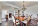 Formal dining room with hardwood floors, chandelier, and large table at 273 Sweet Briar Dr, Fort Mill, SC 29707