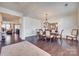 Spacious dining room with hardwood floors, chandelier, and view of living room at 273 Sweet Briar Dr, Fort Mill, SC 29707