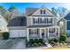 Two-story house with gray siding, dark shutters, and a two-car garage at 273 Sweet Briar Dr, Fort Mill, SC 29707