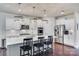 Modern kitchen with white cabinets, large island, and stainless steel appliances at 273 Sweet Briar Dr, Fort Mill, SC 29707