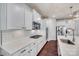 Modern kitchen with white cabinets, quartz countertops, and stainless steel appliances at 273 Sweet Briar Dr, Fort Mill, SC 29707