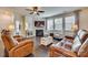 Relaxing living room with fireplace, leather couches, and hardwood floors at 273 Sweet Briar Dr, Fort Mill, SC 29707