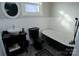 Bathroom with black clawfoot tub and pedestal sink at 303 N Gaston St, Kings Mountain, NC 28086