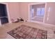 Simple dining area with patterned rug at 303 N Gaston St, Kings Mountain, NC 28086