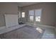 Spacious living room featuring a fireplace and large windows at 303 N Gaston St, Kings Mountain, NC 28086