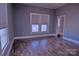 Spacious living room featuring hardwood floors and large windows at 303 N Gaston St, Kings Mountain, NC 28086