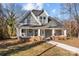 Charming craftsman home with gray siding, brick accents, and a welcoming front porch at 336 3Rd Se St, Hickory, NC 28602