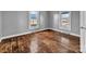 Bedroom with hardwood floors, neutral colors, and natural light at 34 Lee Rd, Stony Point, NC 28678