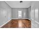 Bedroom with hardwood floors and neutral paint at 34 Lee Rd, Stony Point, NC 28678