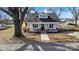 Charming two-story home with a welcoming front porch, black shutters, and a well-maintained yard at 34 Lee Rd, Stony Point, NC 28678