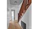 Hallway with wooden stairs and flooring at 34 Lee Rd, Stony Point, NC 28678