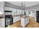 Kitchen with modern appliances, central island, and bright natural light at 34 Lee Rd, Stony Point, NC 28678