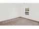 Simple bedroom with carpeted floor and window at 3524 Cloninger Rd, Dallas, NC 28034