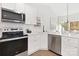 Modern kitchen with stainless steel appliances and white cabinetry at 3524 Cloninger Rd, Dallas, NC 28034