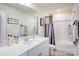 Clean bathroom with bathtub and shower at 3936 Rothwood Ln, Harrisburg, NC 28075