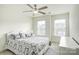 Comfortable bedroom with ceiling fan and large windows at 3936 Rothwood Ln, Harrisburg, NC 28075