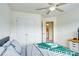 Well-lit bedroom with double doors leading to a bathroom at 3936 Rothwood Ln, Harrisburg, NC 28075