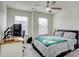 Bright bedroom featuring a built-in desk and a ceiling fan at 3936 Rothwood Ln, Harrisburg, NC 28075