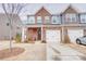 Brick front of townhome with two-car garage at 3936 Rothwood Ln, Harrisburg, NC 28075