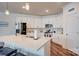 Modern kitchen with white cabinets, stainless steel appliances, and an island at 3936 Rothwood Ln, Harrisburg, NC 28075